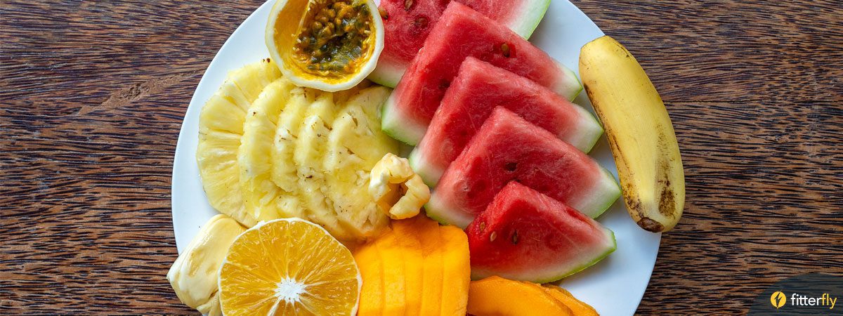 A plate full of fruits – mango, pineapple, banana, watermelon etc A plate full of fruits - mango, pineapple, banana, watermelon etc